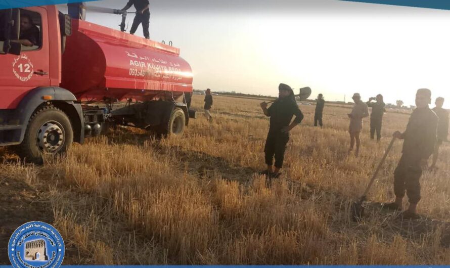 إخماد حريق في أرض محصودة بمنطقة الكرامة